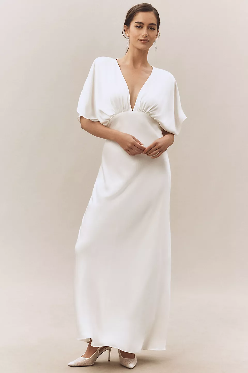 Bride wearing white flutter sleeve maxi dress with v-neck
