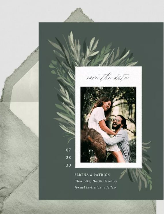 Bride and groom sending digital save the date card to guests via email
