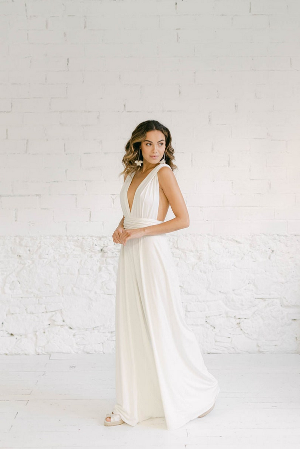 Bride wearing elegant chic bridal jumpsuit