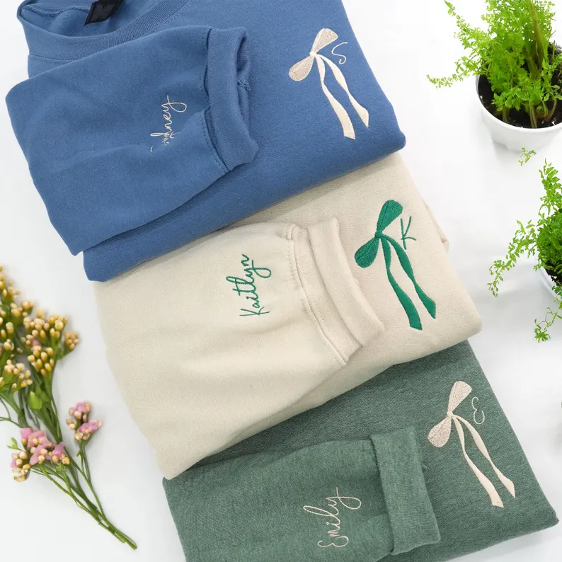 Bridesmaid sweatshirt gifts under $50 with embroidered initial and bow detail