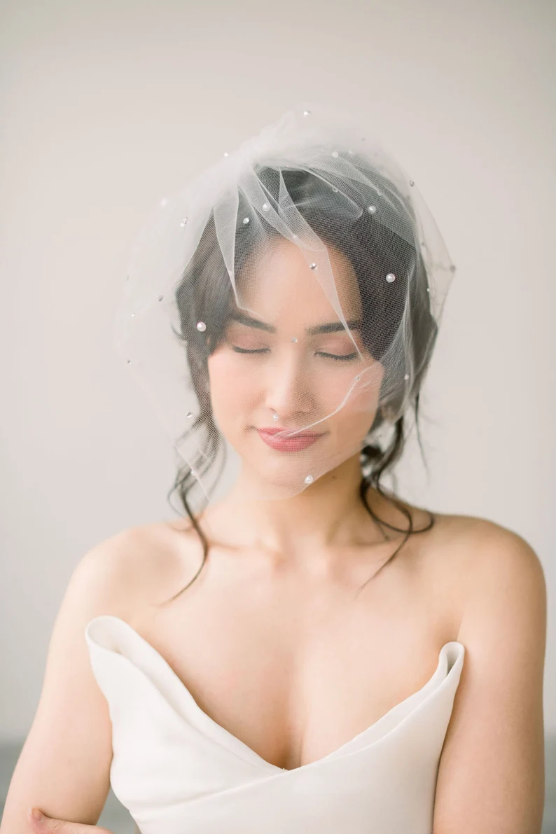 pearl bridal veil with blusher layer over bride's face