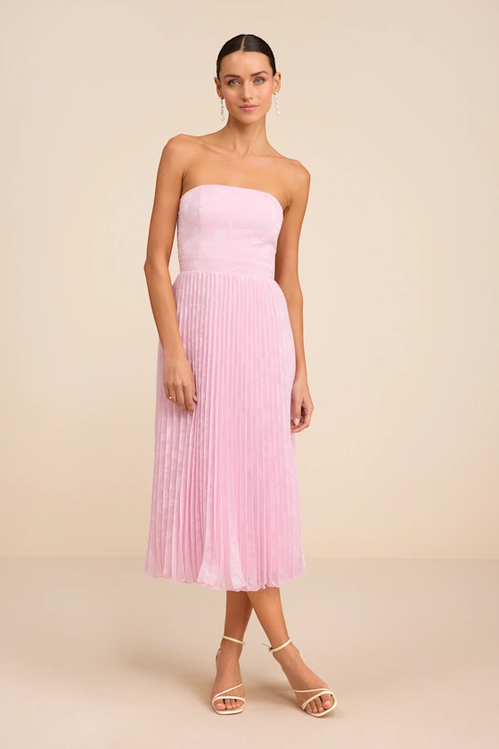 Strapless light pink midi length dress to wear as a guest to a garden party wedding dress code