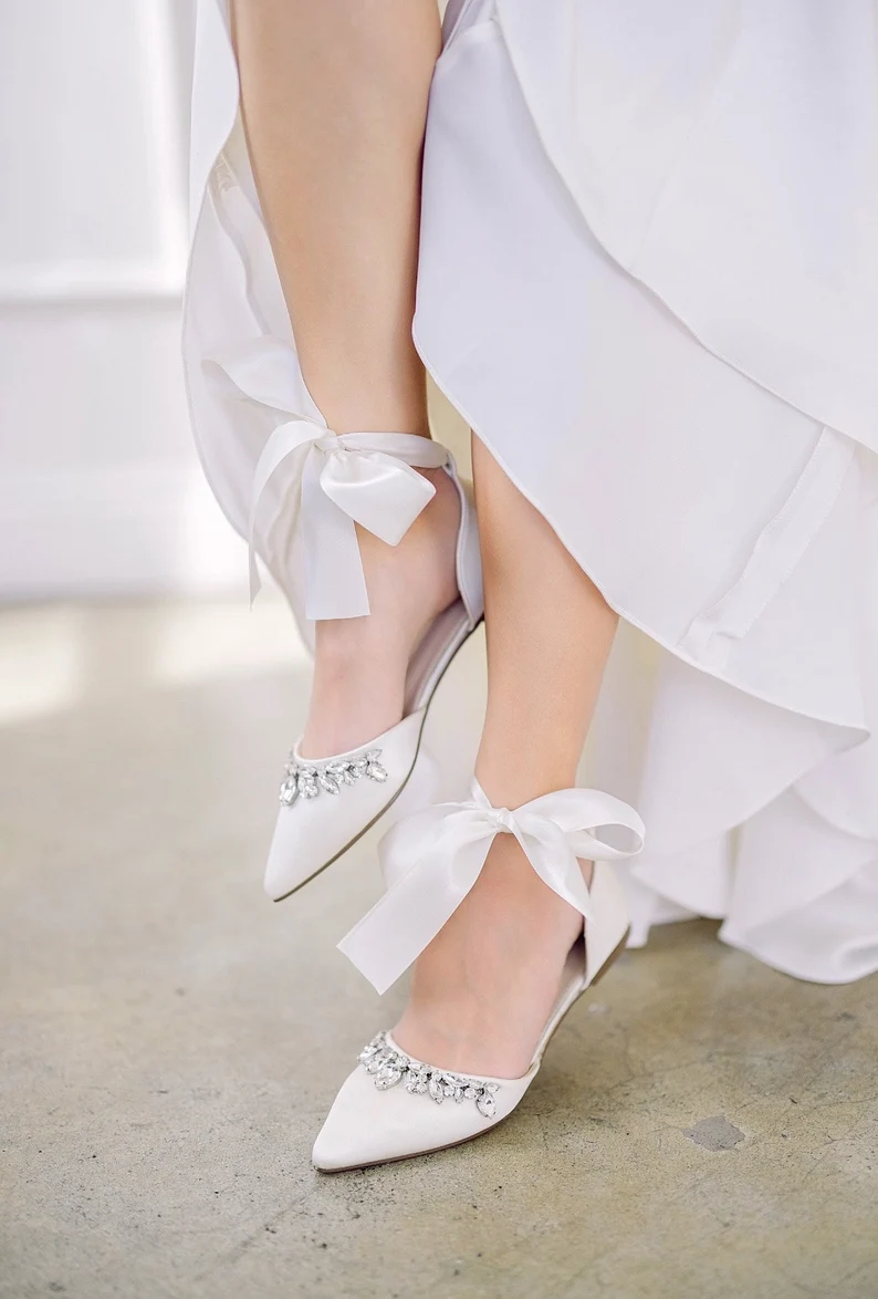 Bride wearing comfortable and elegant bridal flats for outdoor wedding shoes