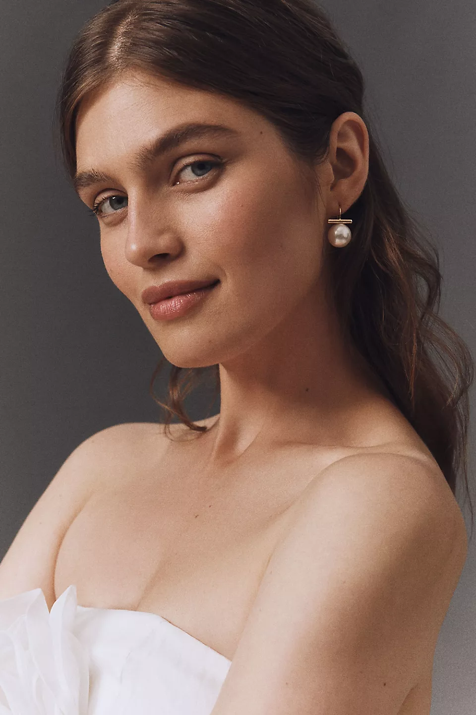 Bridal drop earrings paired with a strapless wedding dress