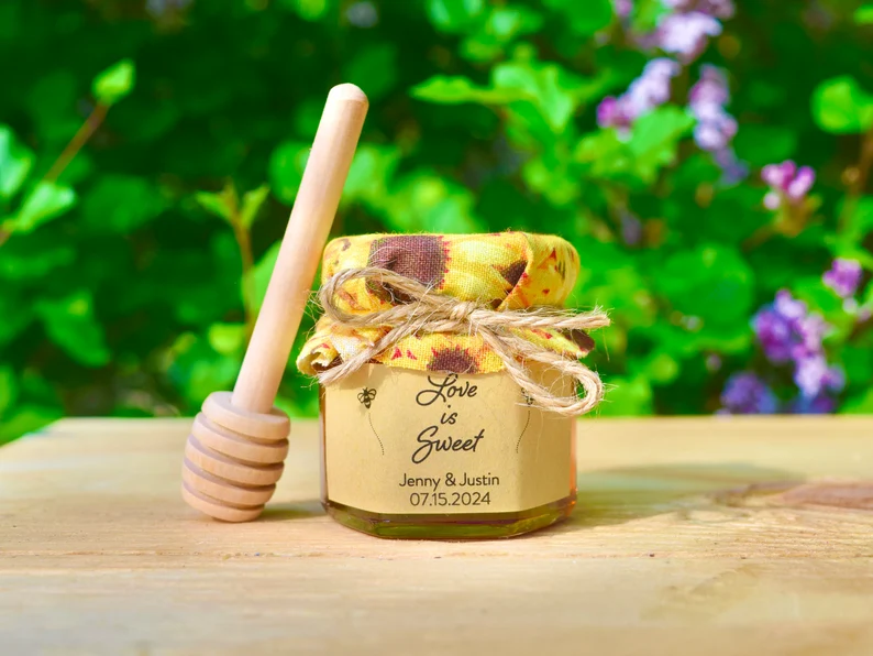 Mini sunflower honey wedding favors with custom labels and twine
