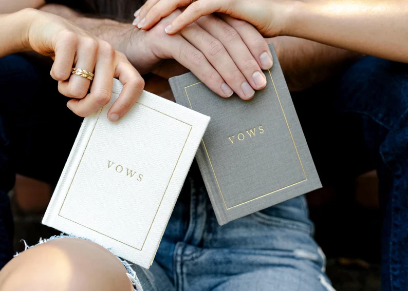 Set of wedding vow books that do not say his or hers on the front