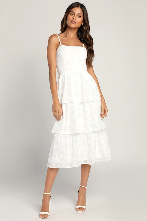 Bride wearing white strappy tiered bridal shower midi dress