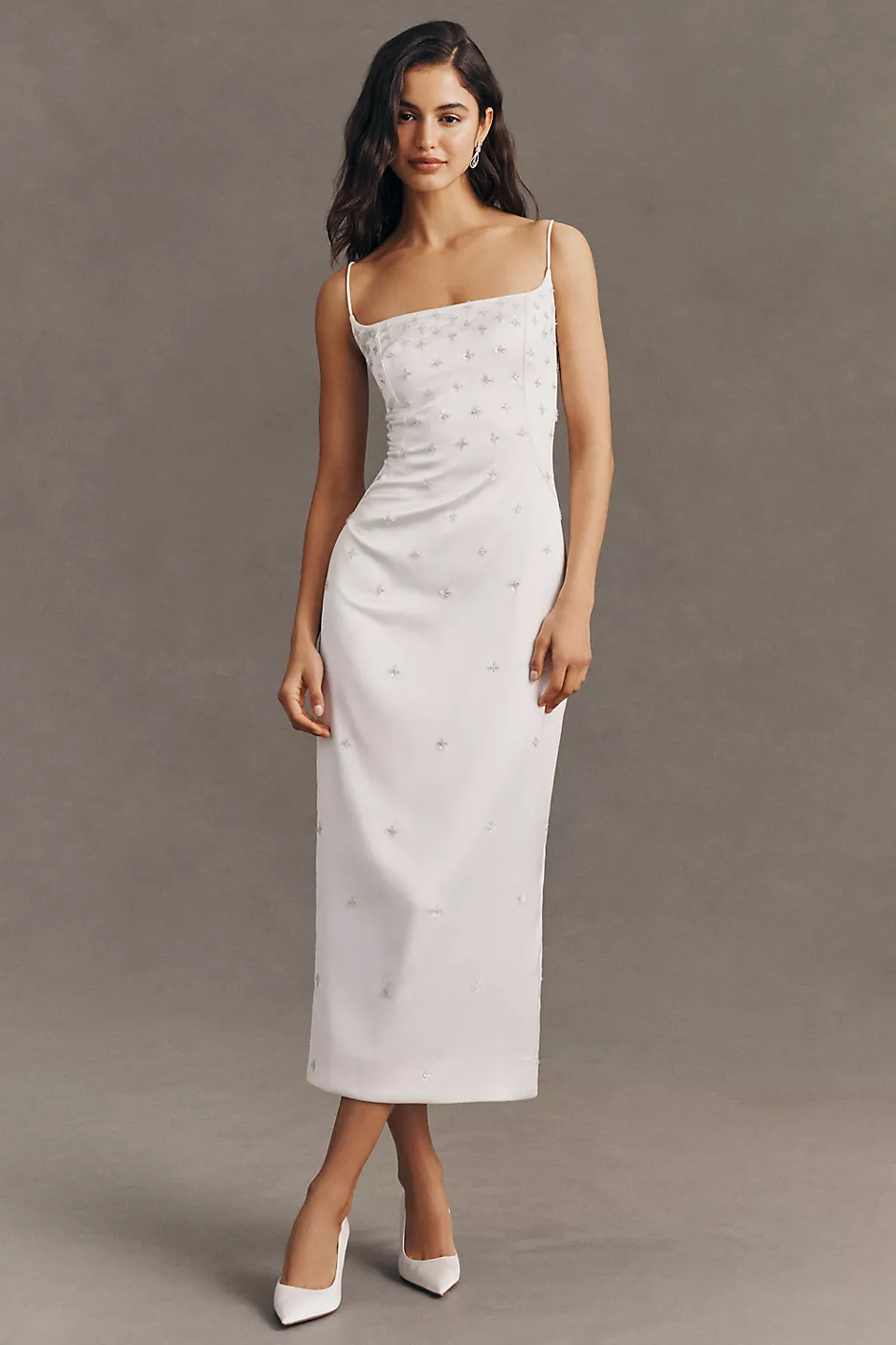 Bride wearing white satin midi dress with white flats for bridal shower outfit