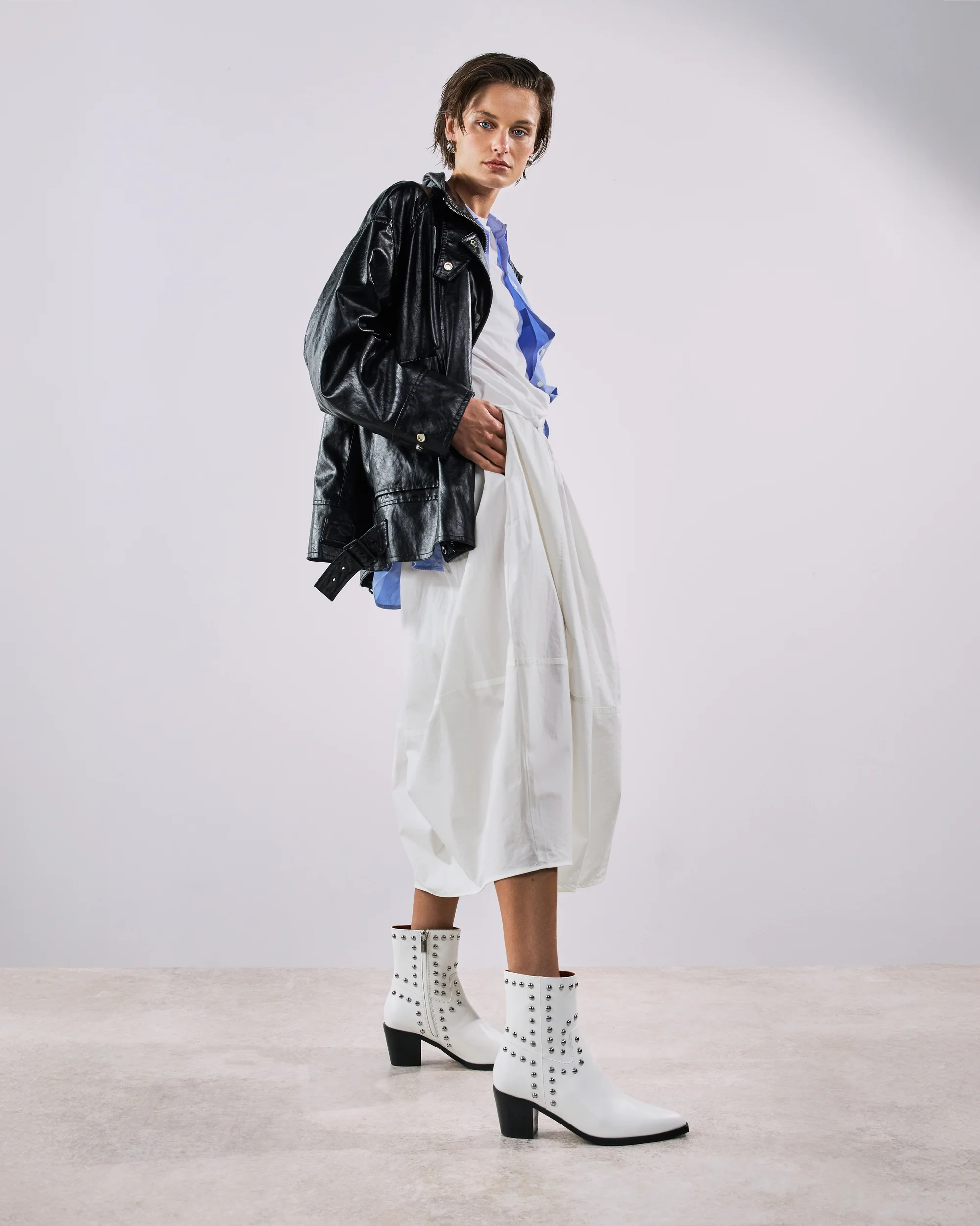 Bride wearing Bared Tetraka ankle boots with structured heel, paired with a rustic wedding gown