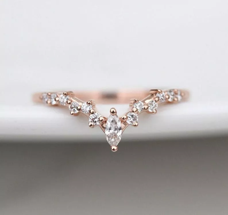 diamond wedding band in v-shape to fit flush with engagement ring