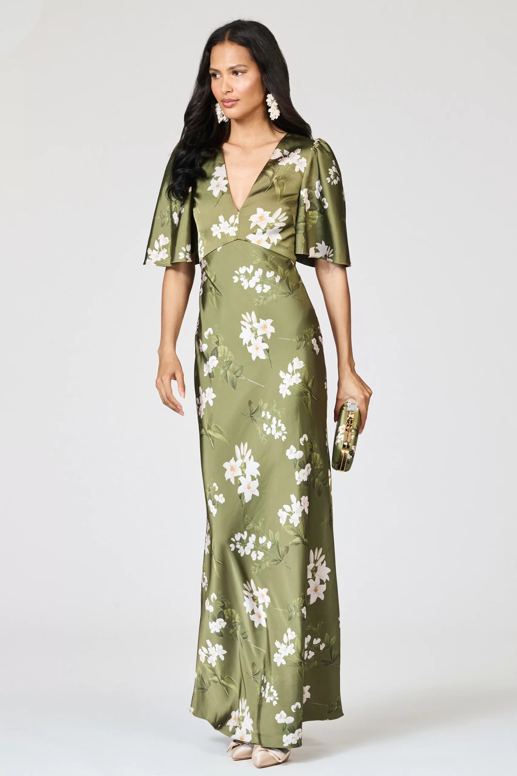 guest wearing flutter sleeve maxi dress with satin for beach wedding attire