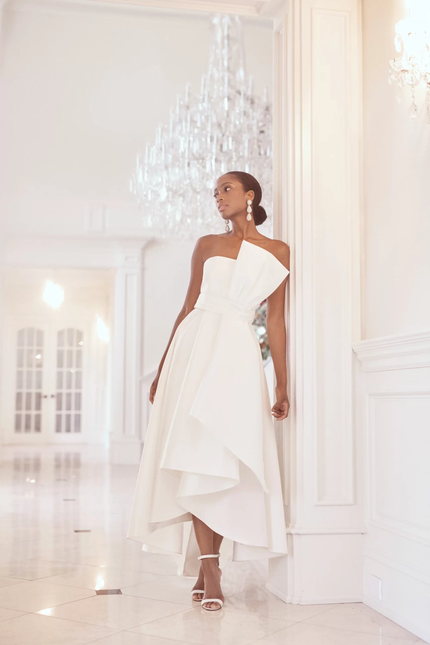 bride in a sleek high-low midi designer dress for a chic bridal brunch