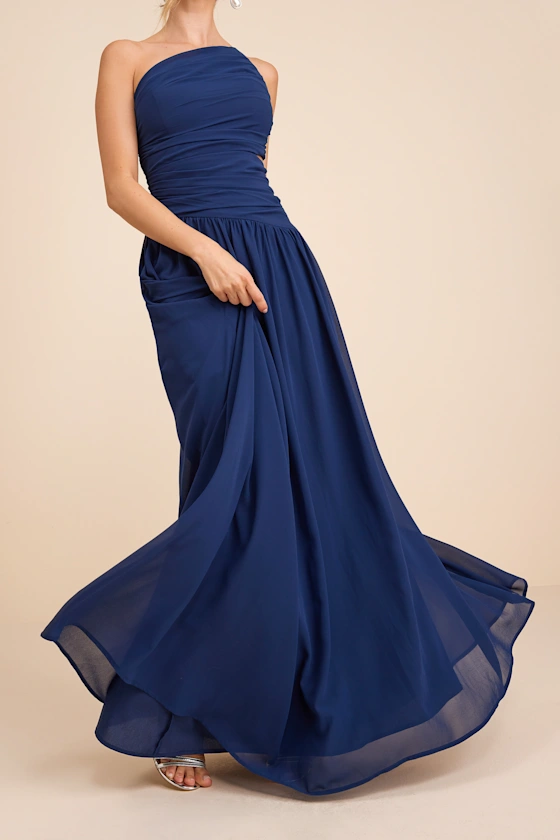 bridesmaid twirling in navy blue maxi - non ugly bridesmaid dresses