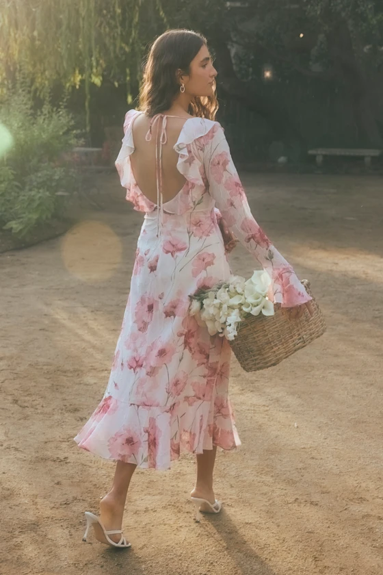 guest wearing pink floral chiffon long sleeve midi for beach wedding guest dress