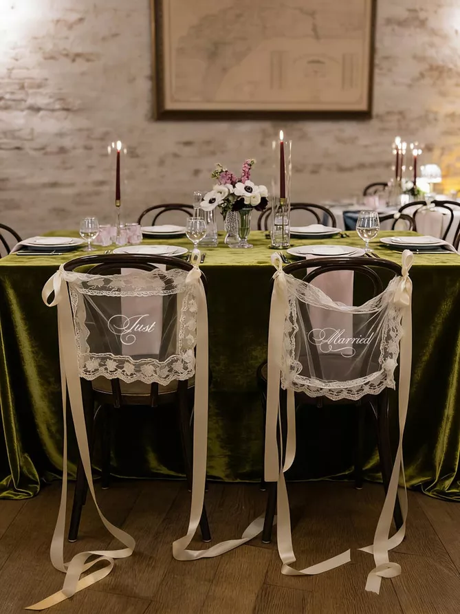 sheer lace just married chair signs on wedding chairs with elegant ribbon ties, perfect for sweetheart table and ceremony decor