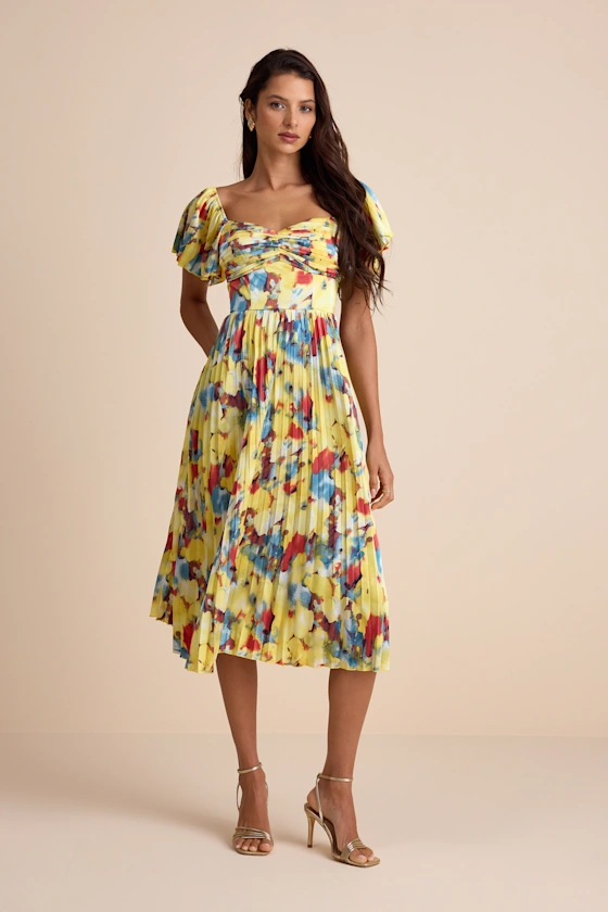 yellow multi abstract print satin midi dress with sleeves, styled for a beach wedding guest
