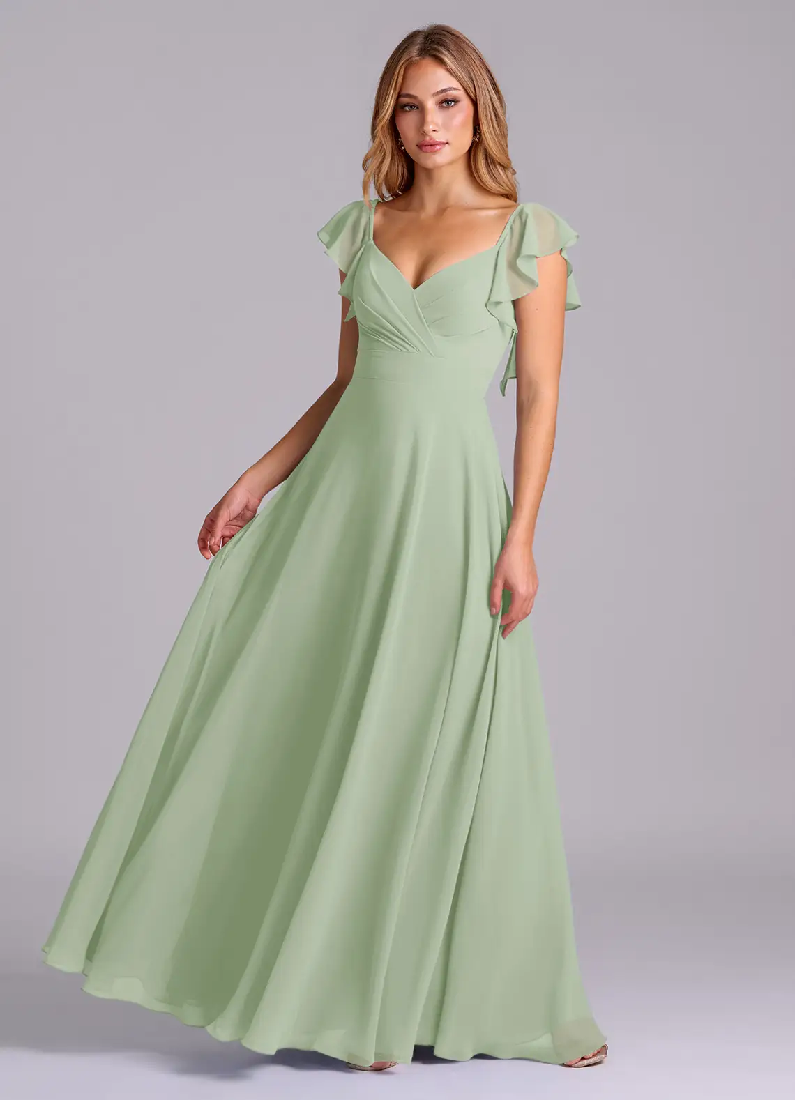bridesmaid wearing sage cap sleeve chiffon dress