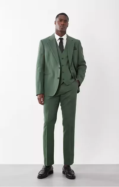 groom wearing dark green wedding suit