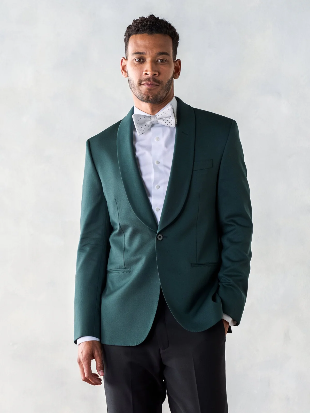 groom wearing emerald green wedding tuxedo suit