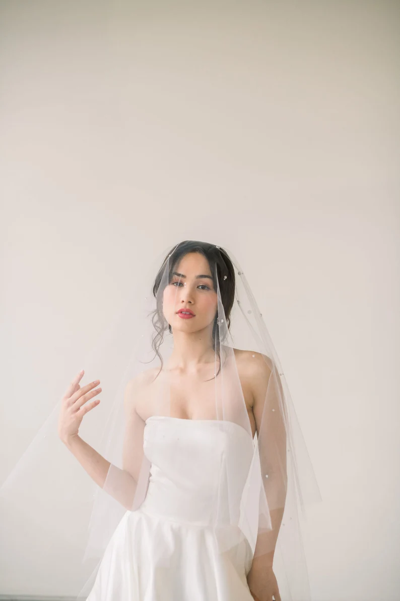 simple fingertip wedding veil with clean modern bridal gown styling