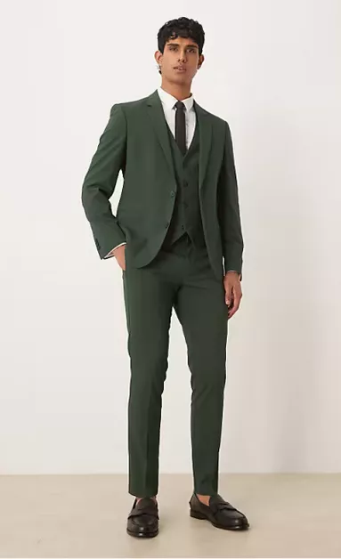 groom wearing dark green three piece suit for wedding attire