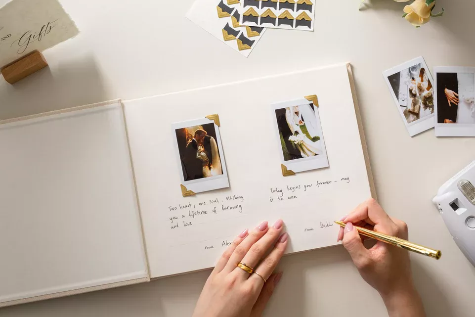 guest book with space for photos on wedding table