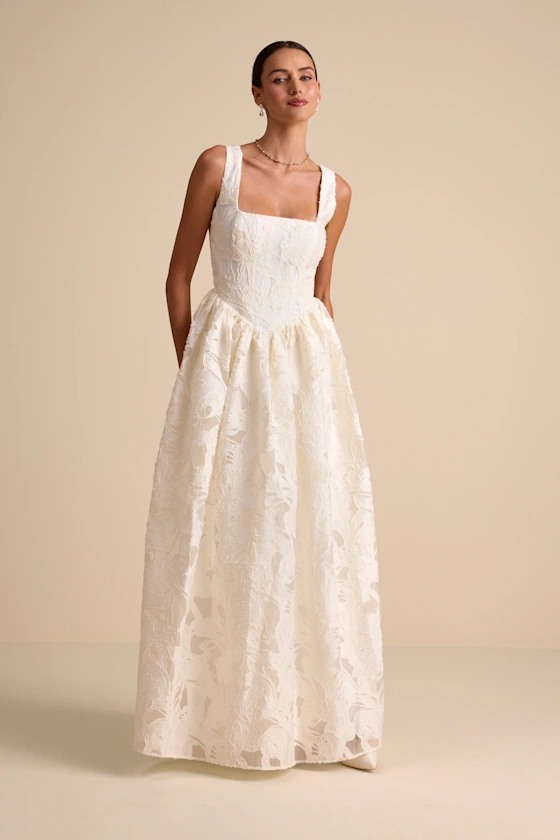 bride wearing ivory floral a-line maxi bridal shower dress