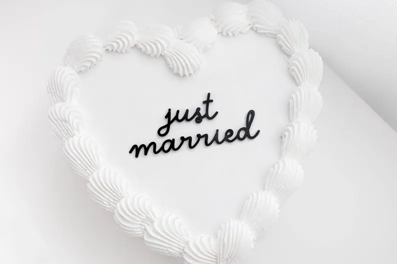 custom mini acrylic heart cake topper on wedding cake