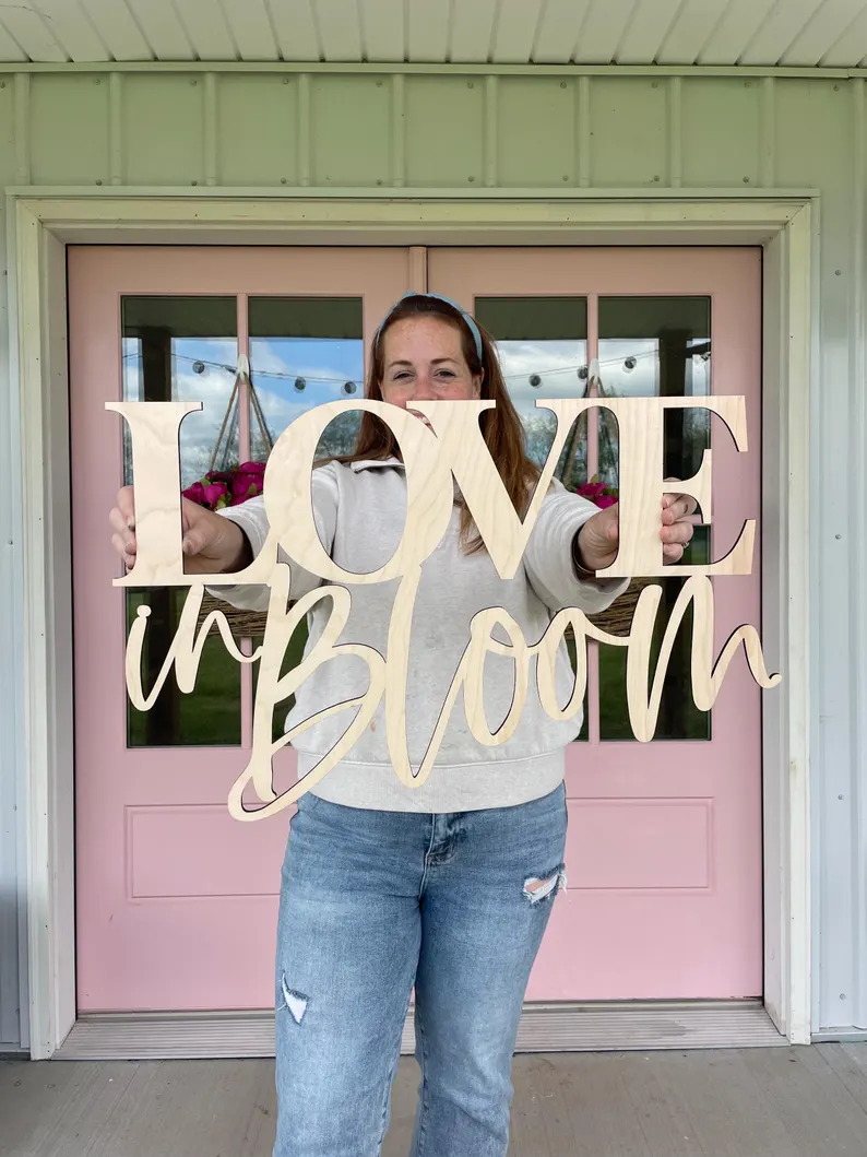 love in bloom sign
