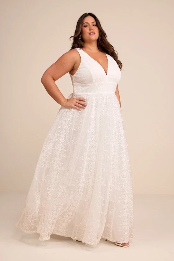 bride wearing embroidered maxi for spring floral bridal shower dress