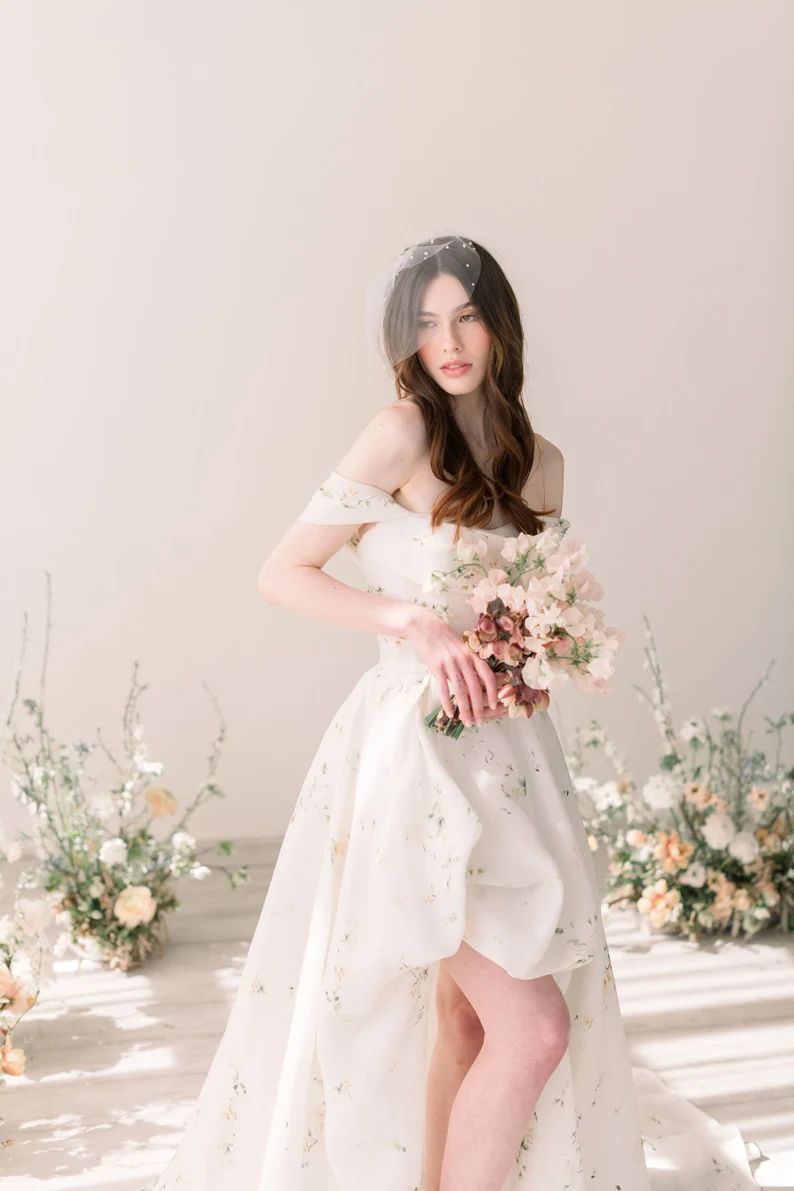 bride wearing soft lightweight bridal veil with tulle and pearls
