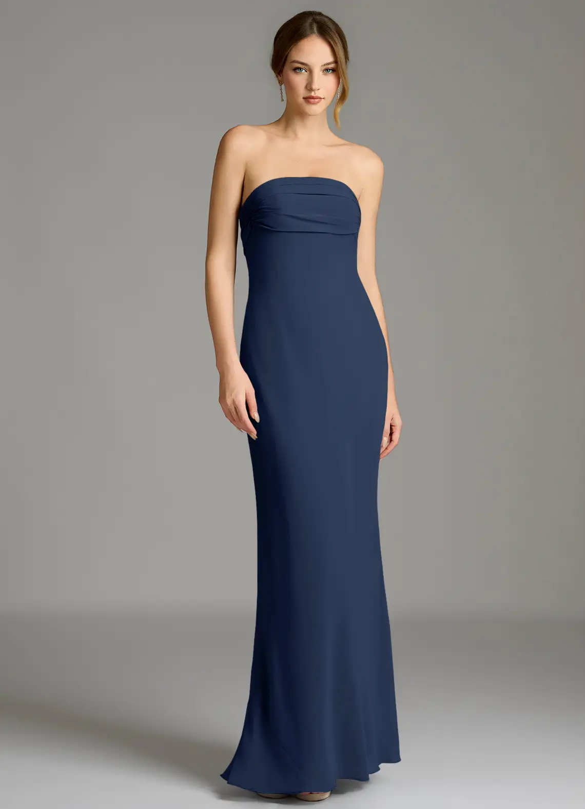 bridesmaid wearing navy strapless azazie bridesmaid dress under $100