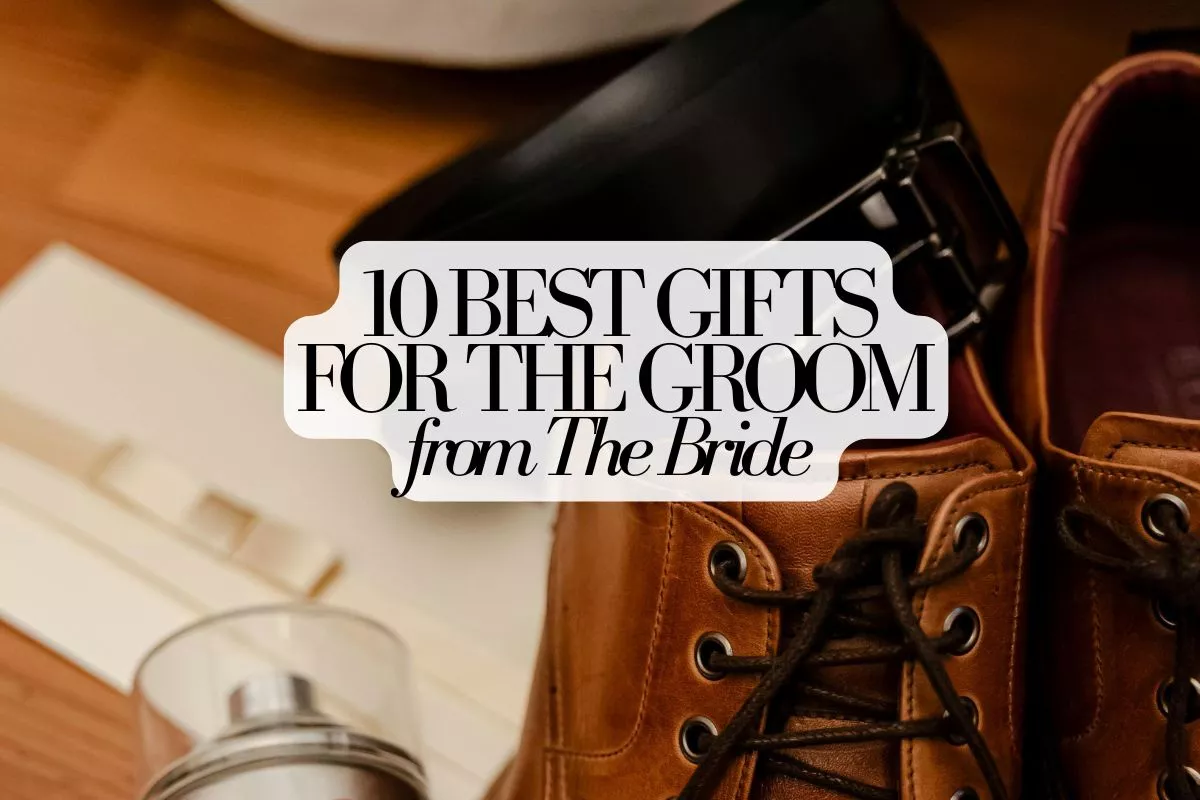 flat lay of sentimental wedding gifts for groom including handwritten letter, watch, and wallet from bride