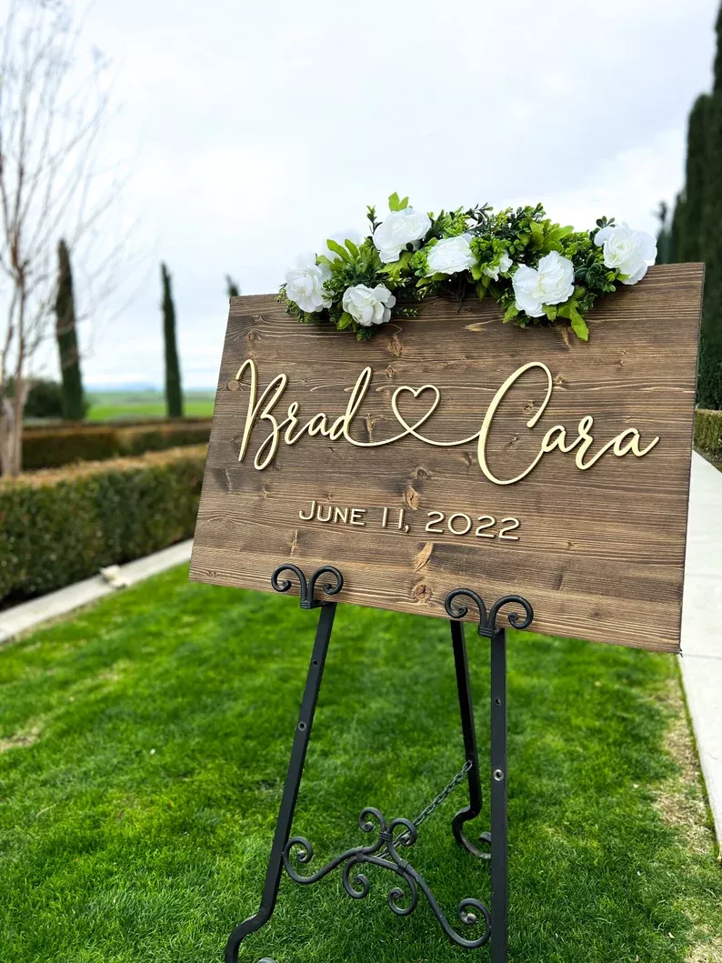 wooden wedding welcome sign with names and wedding date