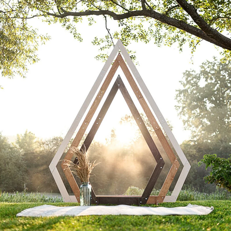 diamond shaped wood ceremony arch for rustic wedding