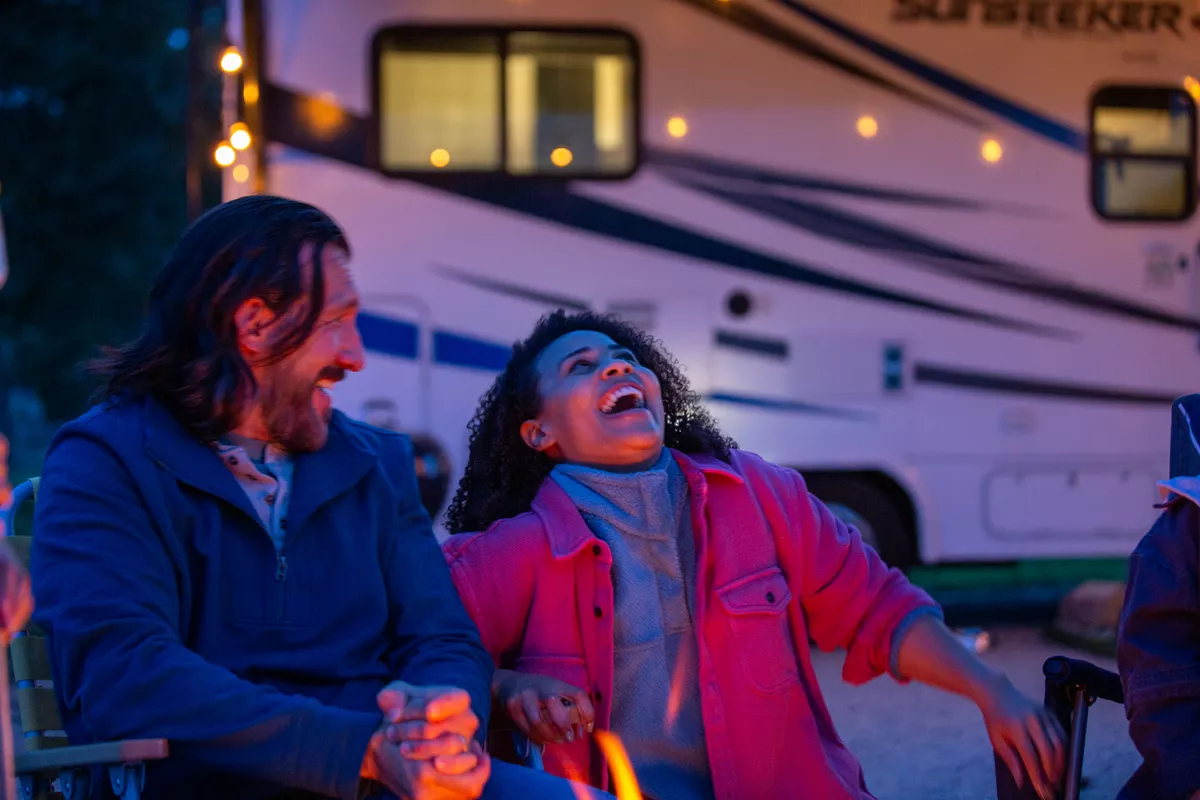 couple exchanging vows outdoors beside their RV during an elopement
