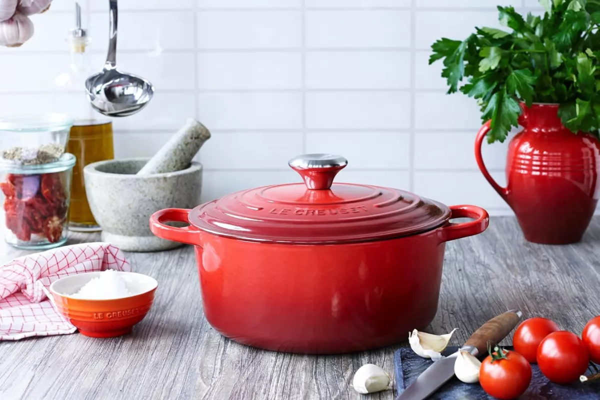 kitchen scene with Dutch oven, mixing bowls, and everyday cookware used as practical wedding gifts