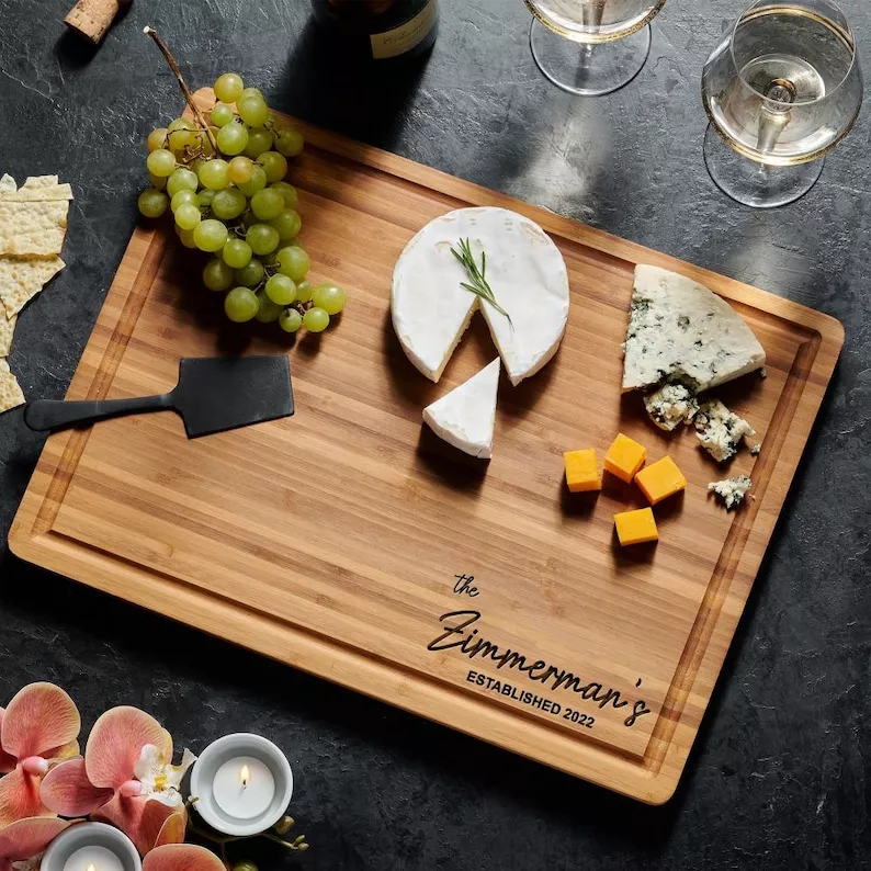 personalized cutting board with engraved name and established date for couples