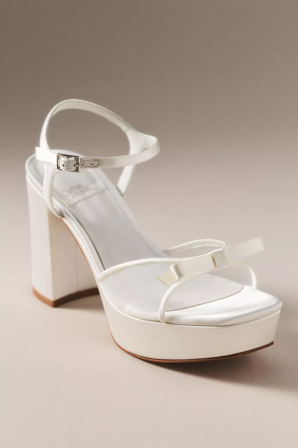 different types of wedding heels including satin, pearl, crystal, and lace wedding heels for brides in platform, high, mid, and low block styles