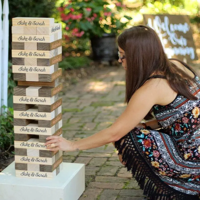 giant tumble tower for guests to have fun and add to experience at your wedding