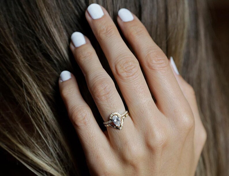 engagement ring photo on ring finger
