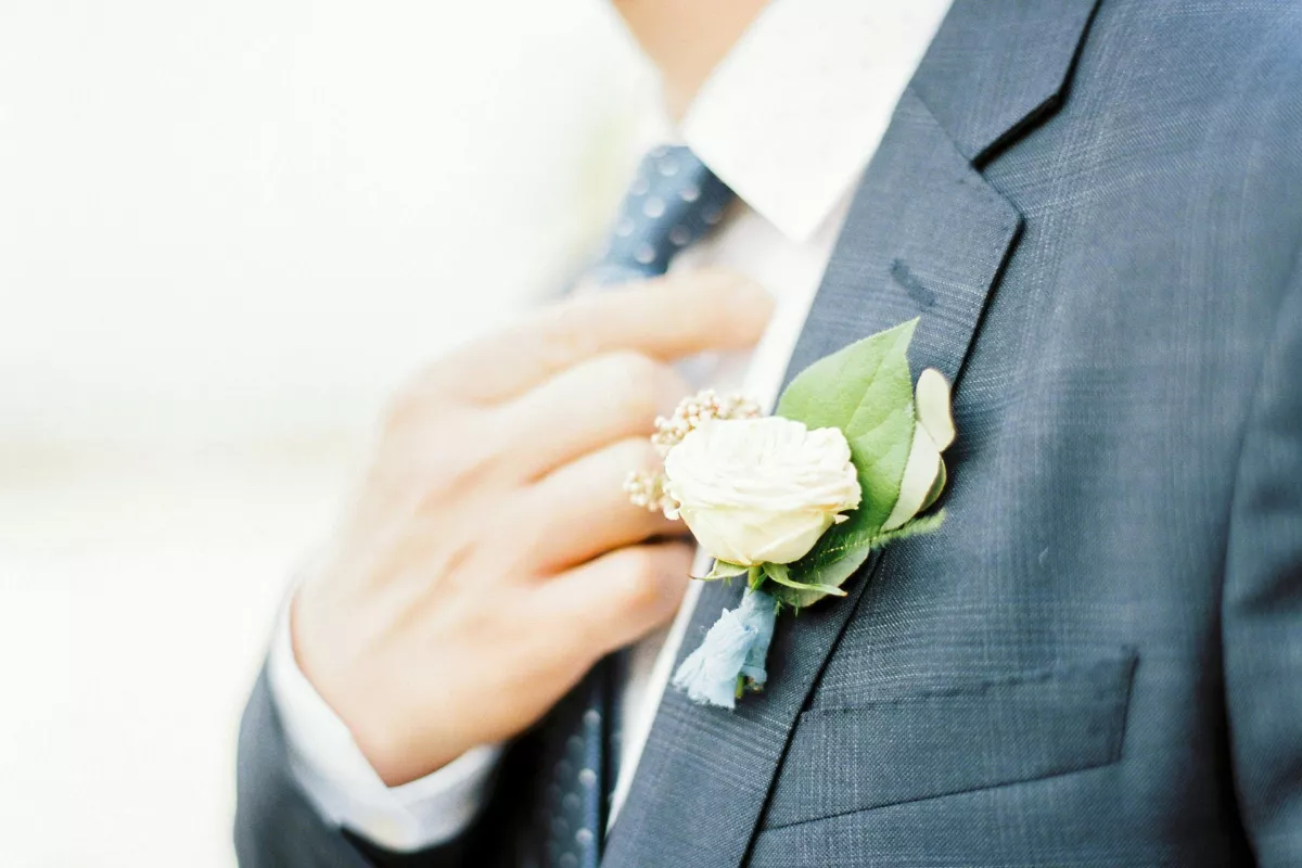 groom in suit with boutonniere