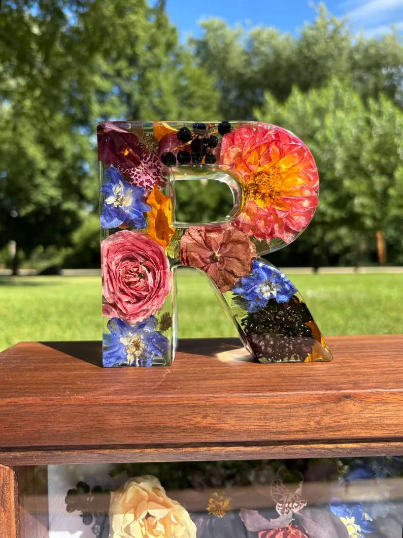 wedding flowers preserved inside a custom resin letter