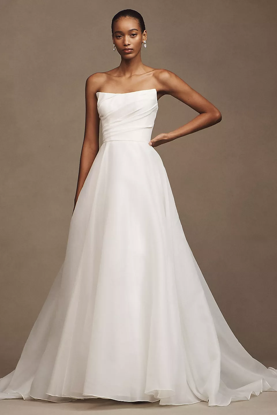 Watters Fortune strapless A-line wedding gown with draped bodice and flowing skirt