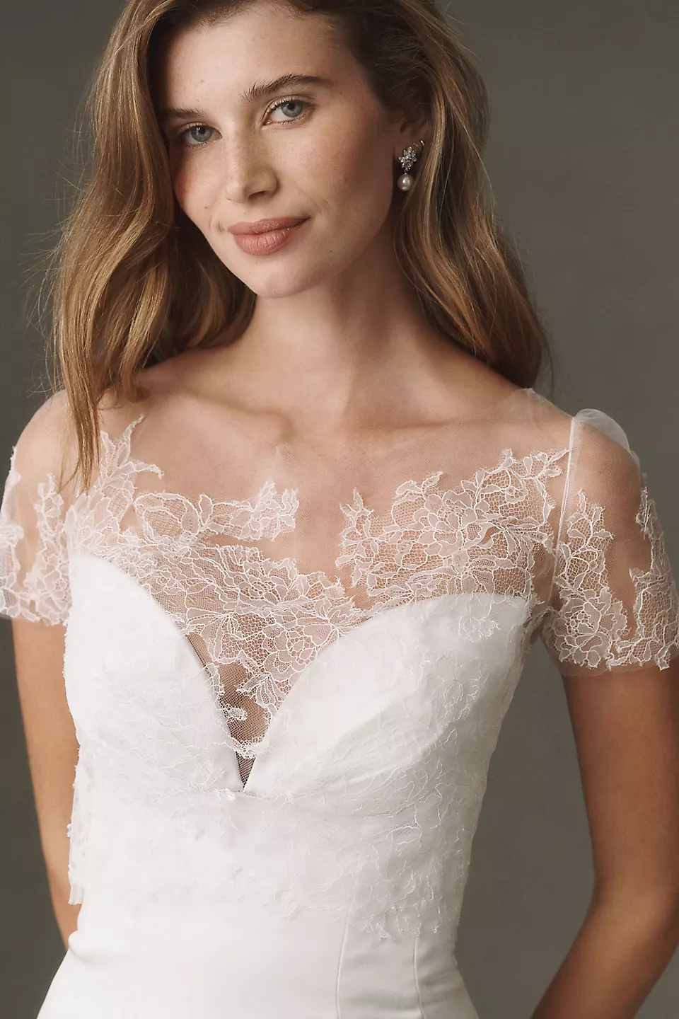 Short-sleeve lace wedding dress topper by Watters
