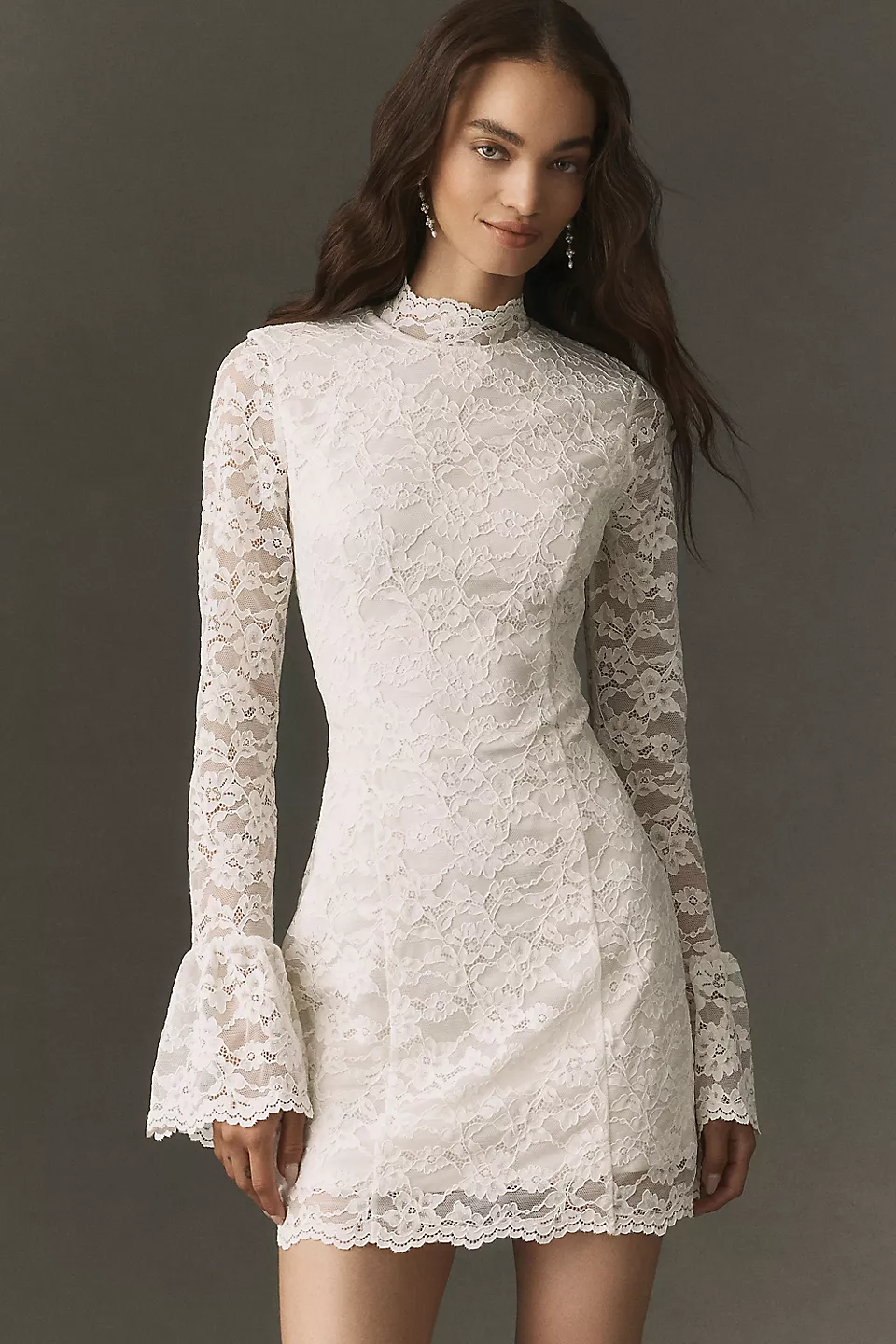 Long-sleeve lace mini dress for a bridal reception