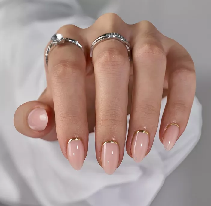 nude colored bridal nails with gold