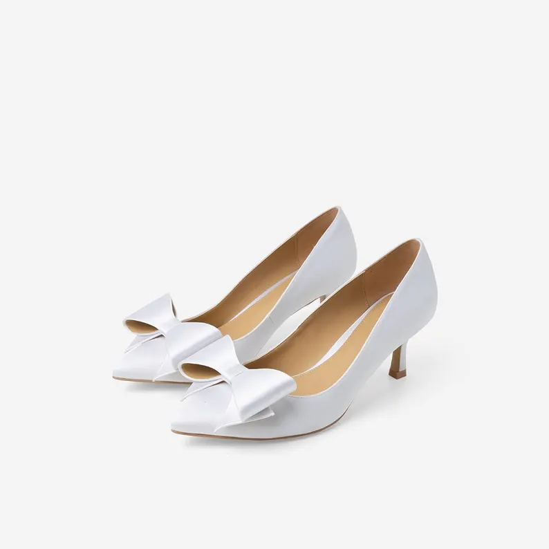 White satin bow pumps for the bride