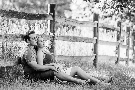 Annie & Josh's Engagement - couple laying in field