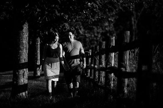 Annie & Josh's Engagement - couple walking in field